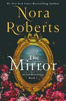 Book cover: "The Mirror" by Nora Roberts. Features an ornate mirror with a landscape and flowers around it.