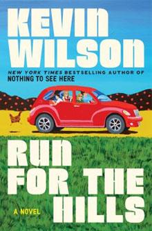 A red car with four people drives past a chicken and hills; text reads "Kevin Wilson Run for the Hills.