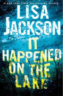 Book cover of "It Happened on the Lake" by Lisa Jackson with raindrops and tree branches over blue water.