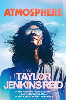 A person with curly hair and sunglasses under a blue sky; text reads "Atmosphere" by Taylor Jenkins Reid.