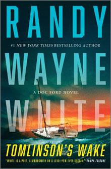 Book cover of "Tomlinson's Wake" by Randy Wayne White, featuring a sailboat on the water at sunset.
