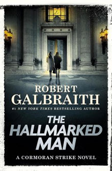 Book cover: Two figures walk toward a grand building. Title: "The Hallmarked Man" by Robert Galbraith.
