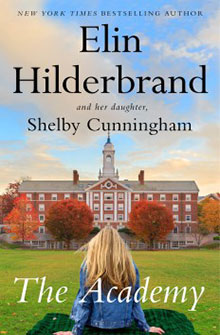 A girl sits on grass facing a large brick academy building with autumn trees, book cover text above her.