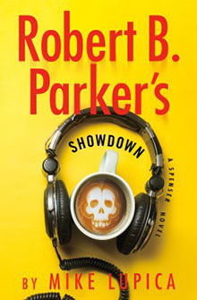 A coffee cup with a skull design sits inside headphones on a yellow background, with book title text above.