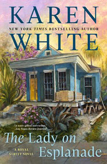 Book cover for "The Lady on Esplanade" by Karen White, featuring a blue house with a porch and lush greenery.