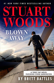 A man walks on a rooftop near wind turbines; text reads "Stuart Woods' Blown Away by Brett Battles.