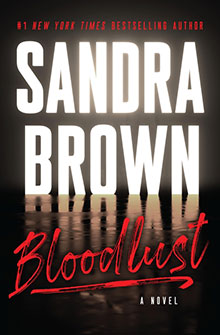 Book cover for "Bloodlust" by Sandra Brown, with bold white and red text on a dark background.