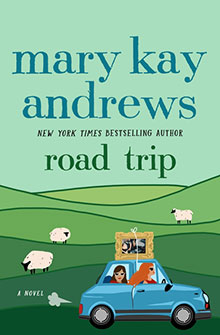 Illustrated book cover: two women in a blue car driving through green hills with sheep, title "Road Trip.