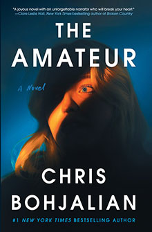 Book cover for "The Amateur" by Chris Bohjalian featuring a woman’s face partially lit with blue and gold tones.