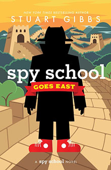 Book cover: Silhouette of a person on the Great Wall of China with “Spy School Goes East” title in bold letters.