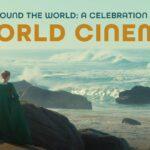 A person in a green dress stands on rocks, looking at the ocean. Text: "Around the World: A Celebration of World Cinema.