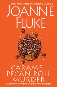 Book cover of "Caramel Pecan Roll Murder" by Joanne Fluke, featuring a caramel pecan roll in the center on a red background.