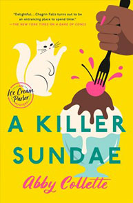 Book cover of "A Killer Sundae" by Abby Collette, depicting a hand adding a cherry to a sundae and a white cat nearby.