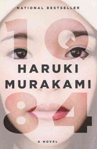 Book cover of "1Q84" by Haruki Murakami, showing a close-up of a woman's face with the title text overlaying it.