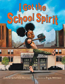 Cover of ‘I Got the School Spirit’ shows a happy girl jumping in front of a school, holding a book.