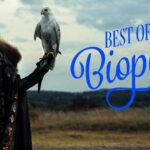 A woman in regal attire holds a falcon, with text reading "Best of Biopics" on a field background.
