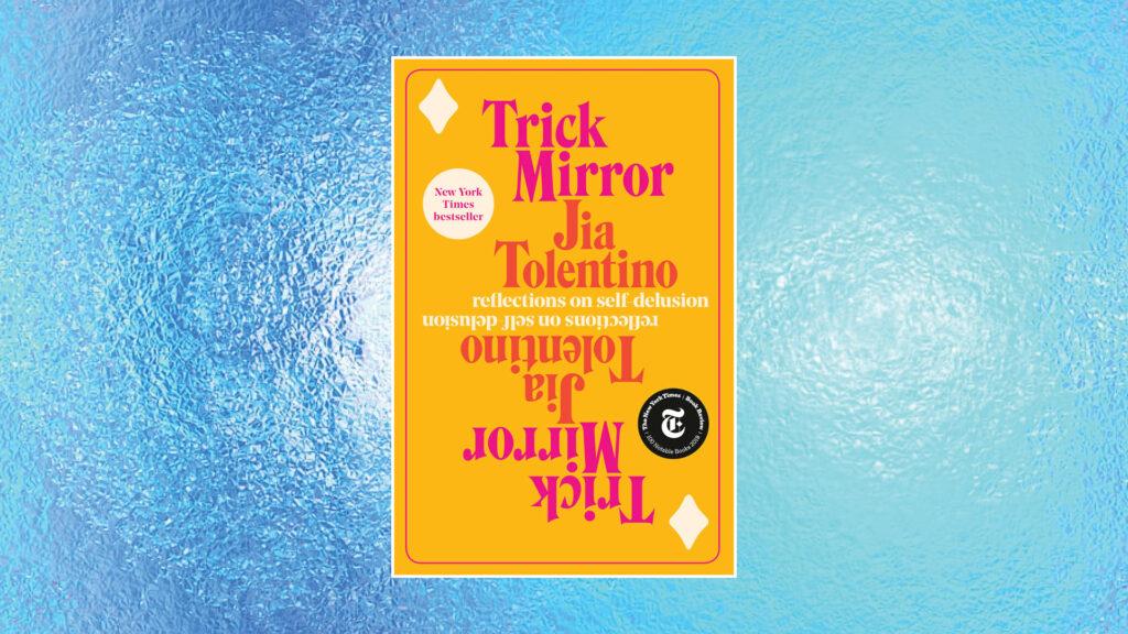 A bright orange book, "Trick Mirror" by Jia Tolentino, on a textured blue background.