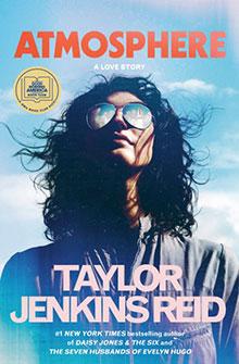 A woman in sunglasses looks up; "Atmosphere" by Taylor Jenkins Reid is written over a blue sky background.