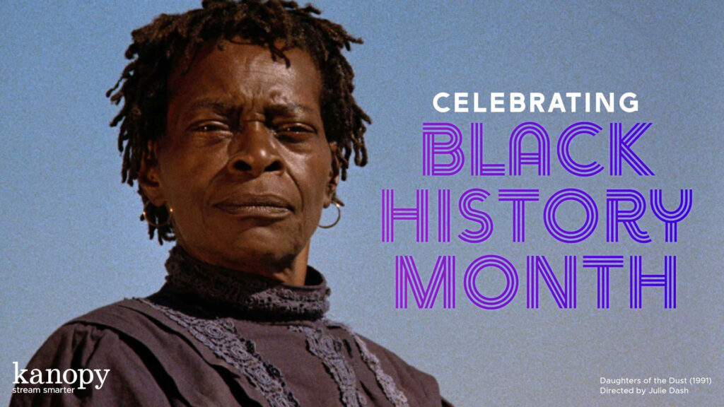 A woman in period clothing stands outside with text: Celebrating Black History Month.