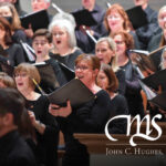 A choir sings together in concert, holding sheet music; "Chicago Master Singers" text appears in the foreground.
