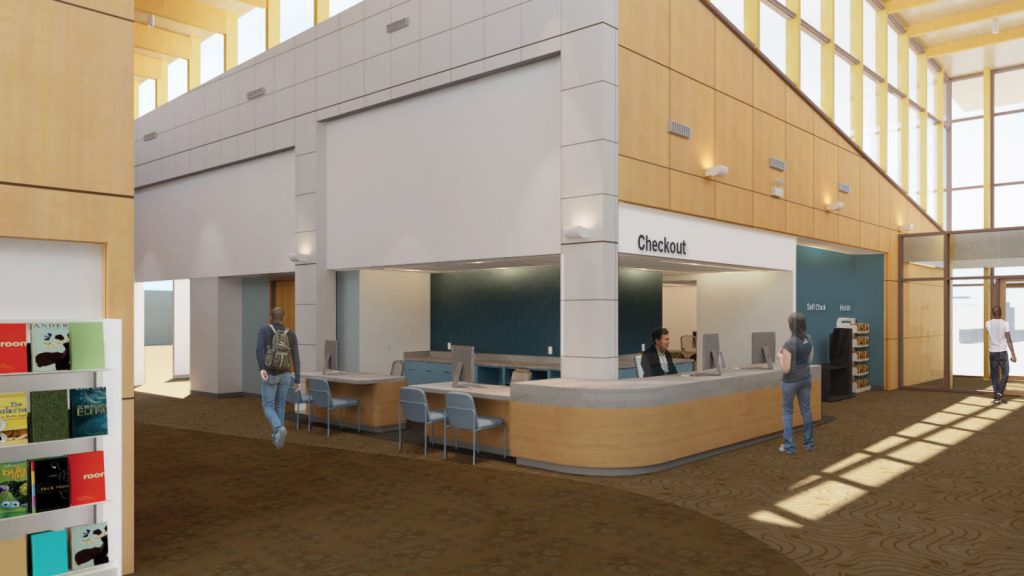 Spacious library interior with people near a checkout counter and shelves filled with books on the left.