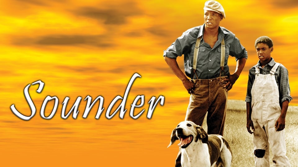 A man, a boy, and a dog stand together under an orange sky with the word "Sounder" written to the left.