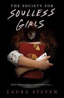 Book cover of "The Society for Soulless Girls" featuring a girl holding a red book with a crescent moon symbol.