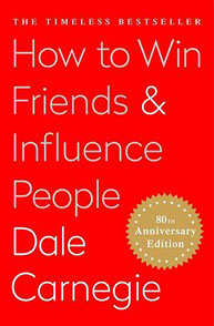 Red cover of "How to Win Friends & Influence People" by Dale Carnegie, 80th Anniversary Edition.