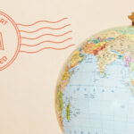 A globe with a “No Passport Required” stamp graphic beside it on a light background.