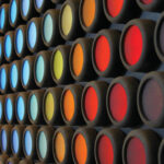 Rows of circular buttons in various colors, creating a pattern on a dark background.