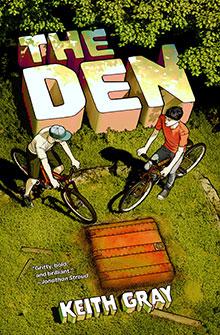 Two boys with bikes stand by a hidden den in the grass; book title "The Den" and author "Keith Gray.