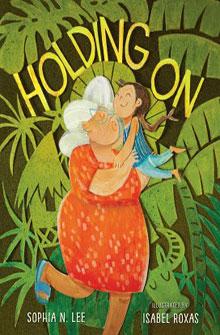 Book cover of "Holding On" showing an elderly woman in a red dress holding a happy child with foliage in the background.