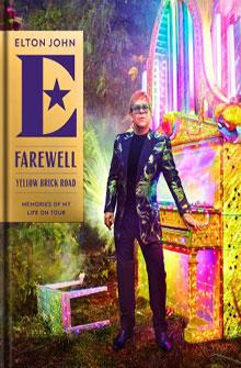 Elton John stands in front of a colorful piano with the text "Farewell Yellow Brick Road" on the left side.