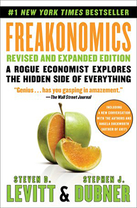 Cover of "Freakonomics" by Steven D. Levitt and Stephen J. Dubner, featuring a partially split orange disguised as an apple.