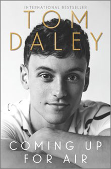 Black-and-white book cover with a man resting his chin on his hands, titled "Coming Up for Air" by Tom Daley.