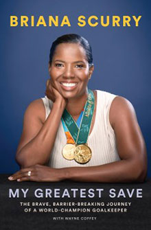 Cover of "My Greatest Save" shows Briana Scurry smiling, wearing two gold medals around her neck, with her hand on her chin.