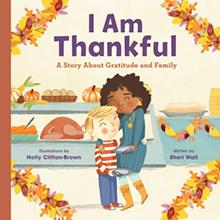 Cover of "I Am Thankful" showing two children hugging, surrounded by autumn leaves and food.