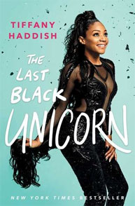 Book cover of "The Last Black Unicorn" by Tiffany Haddish featuring the author in a black outfit against a light blue background.