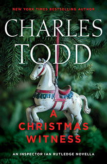 A white carousel horse ornament hangs on a Christmas tree; text reads "A Christmas Witness" by Charles Todd.