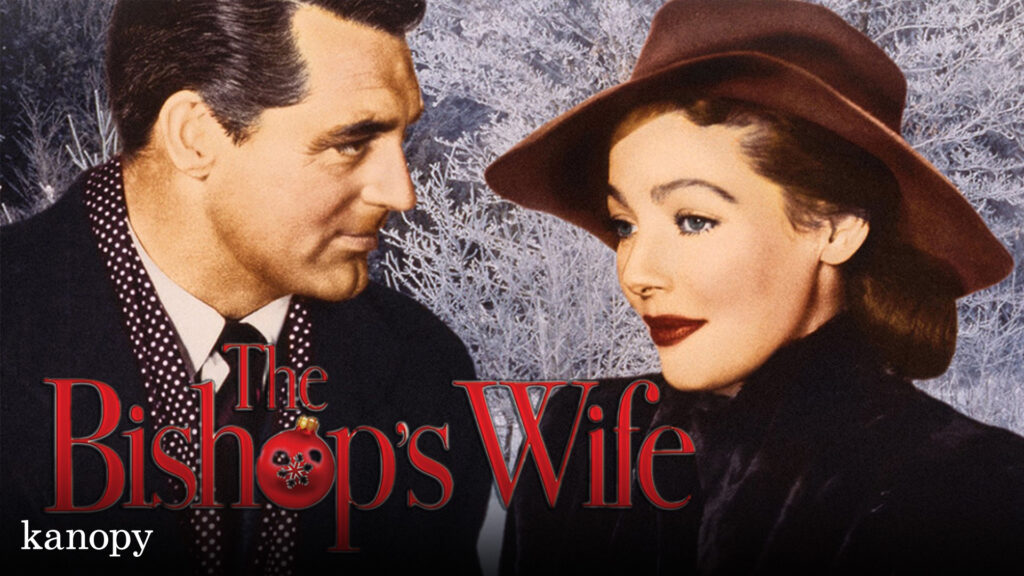 A man and woman in winter clothing stand close together; text reads "The Bishop's Wife.