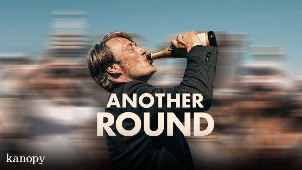 A man in a suit drinks from a bottle with the text "ANOTHER ROUND" over a blurred crowd.