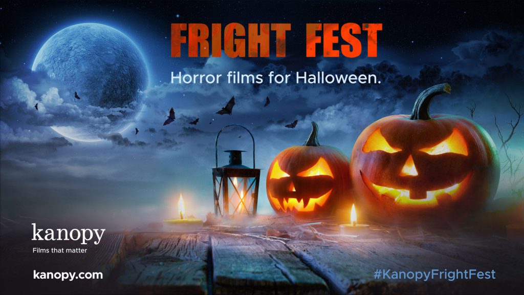 Two carved pumpkins, candles, and a lantern on a wooden surface with a moonlit sky and bats. Text: "Fright Fest. Horror films for Halloween.