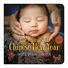 A baby is held gently on a book cover titled "The Animals of Chinese New Year" by Jen Sookfong Lee.