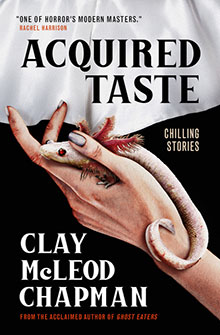 A pale lizard curls around a woman's hand as she pulls back a white sheet; book title reads "Acquired Taste.