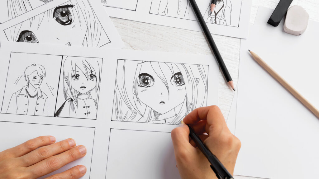 A person draws manga characters with large eyes on comic panels using a black pen on a white desk.
