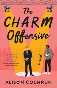 Book cover of "The Charm Offensive" by Alison Cochrun, featuring two people standing under spotlights on a pink background.