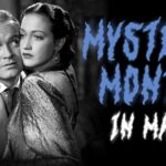 A worried man and woman embrace with "Mystery Month in May" written in jagged blue letters beside them.