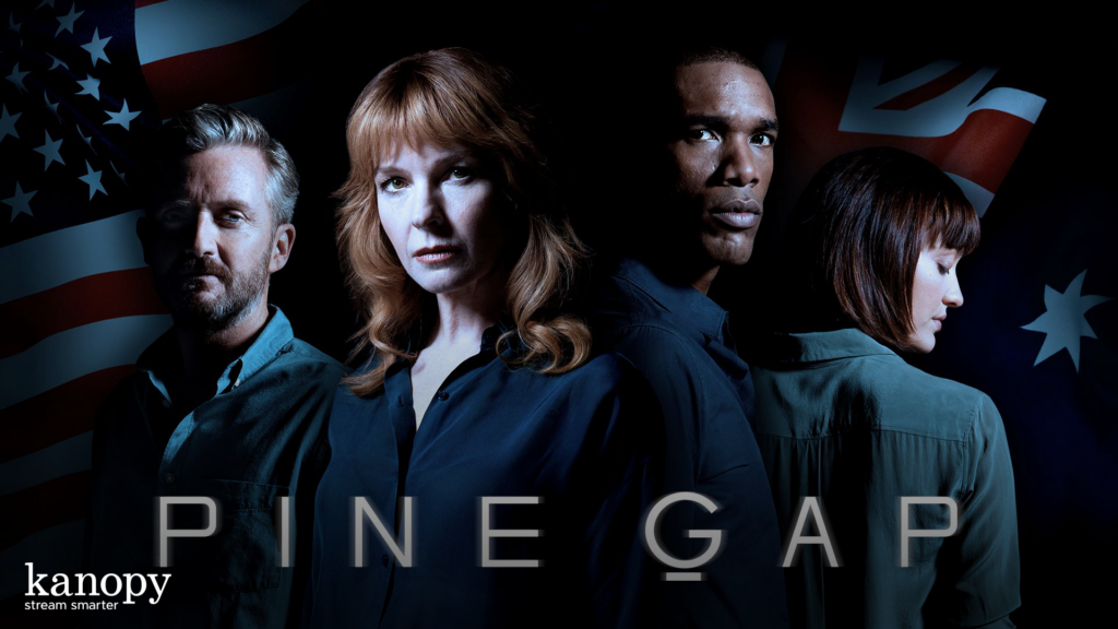Four serious people stand in front of US and Australian flags, with "Pine Gap" and "kanopy" text below.