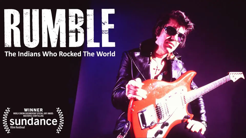 Musician in sunglasses and leather jacket plays electric guitar, with "RUMBLE" documentary title and Sundance award.