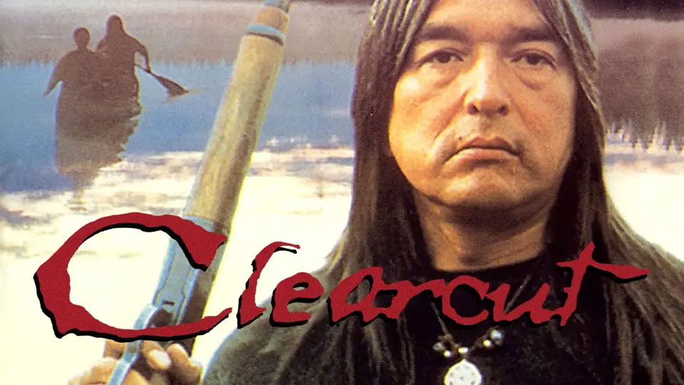 A stern man with long hair holds a rifle by a lake; "Clearcut" is written in red across the image.